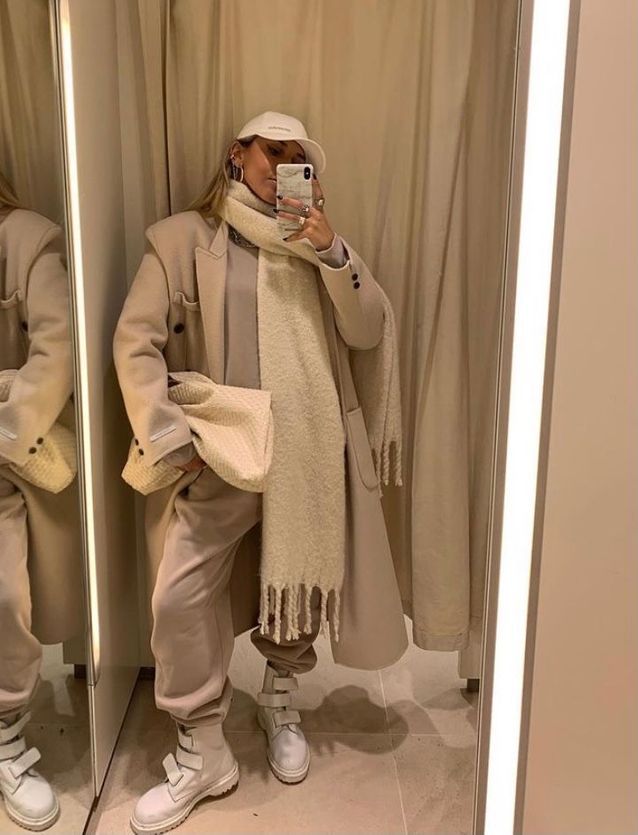 Beige jogging bottoms and white boots